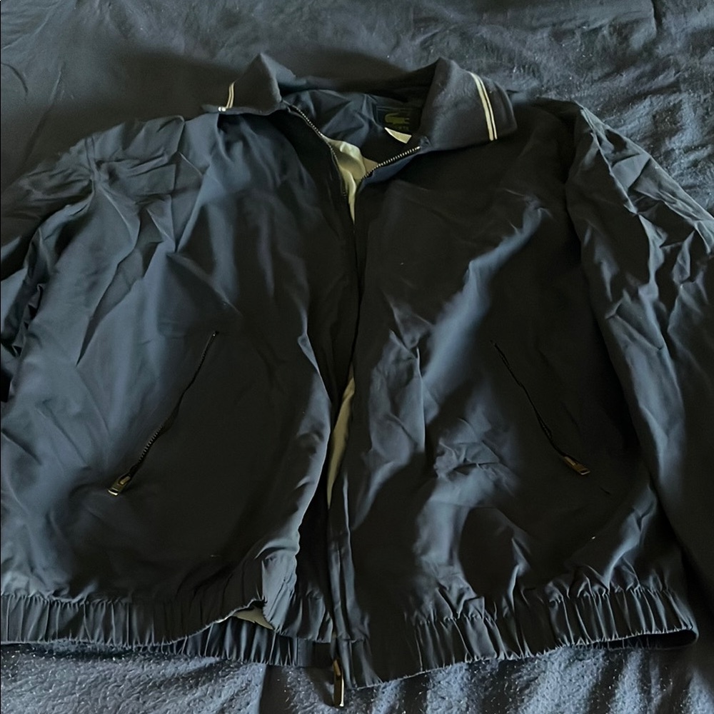 Vintage Lacoste Navy Blue Jacket with Zip-Up Closure and Stand-Up Collar